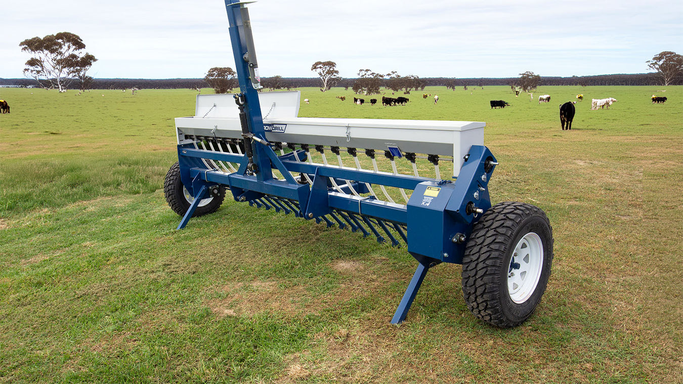 Agrowdrill Pasture Seeder in Australian pasture land with cows grazing in background
