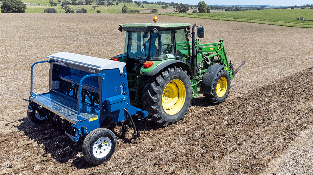 AD083 with 3PL towed by John Deere tractor
