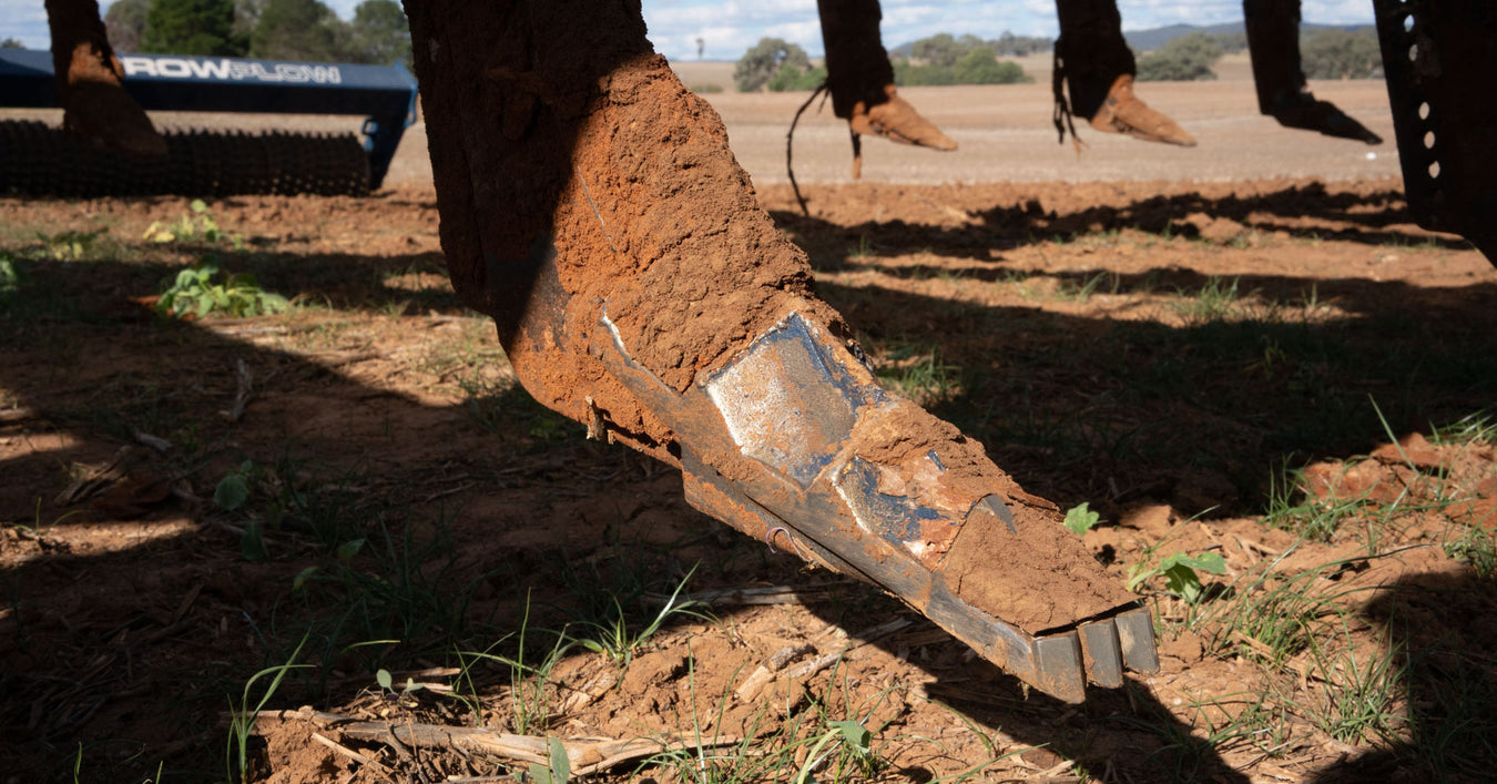 #9 Shank blade with dirt showing how it is smashing through compaction