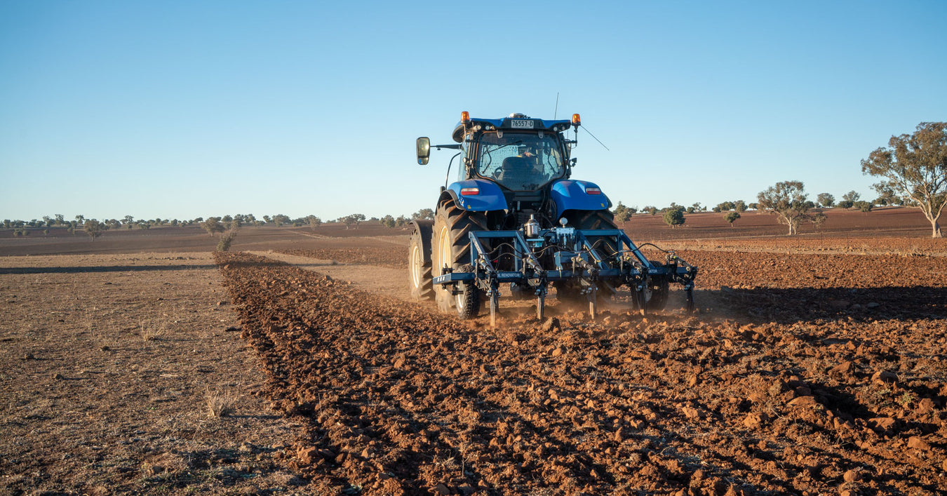 AP31 3PL mid sized plough deep ripping behind new holland tractor