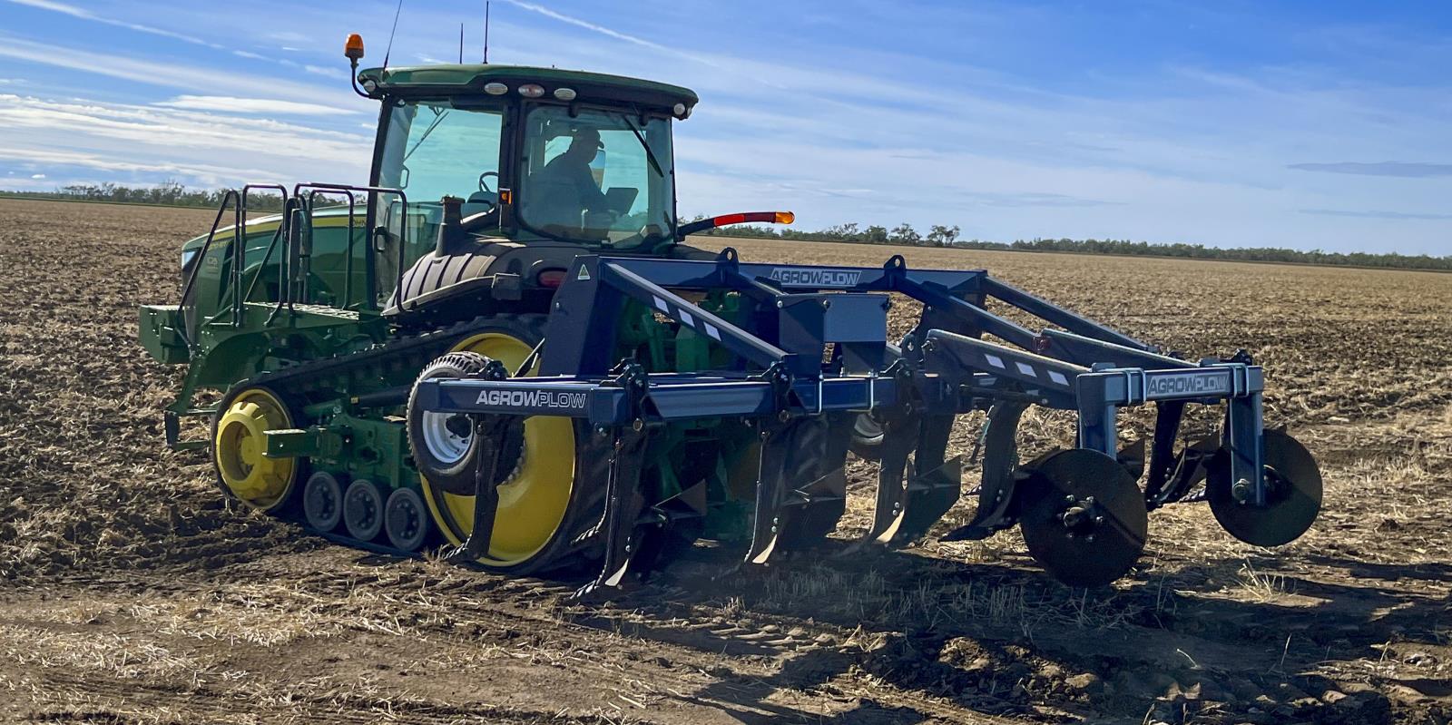 CP62 Cotton Plough with stabilisation arms and furrows attached to tractor via three point linkage