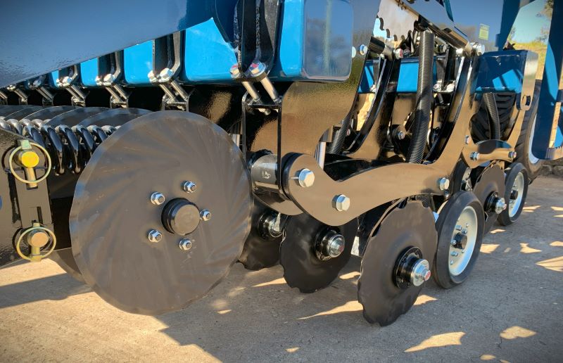 Coulters and double disc ground following on triple disc seeder