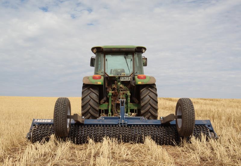 Agrowplow Flexi-Roller being towed by green tractor